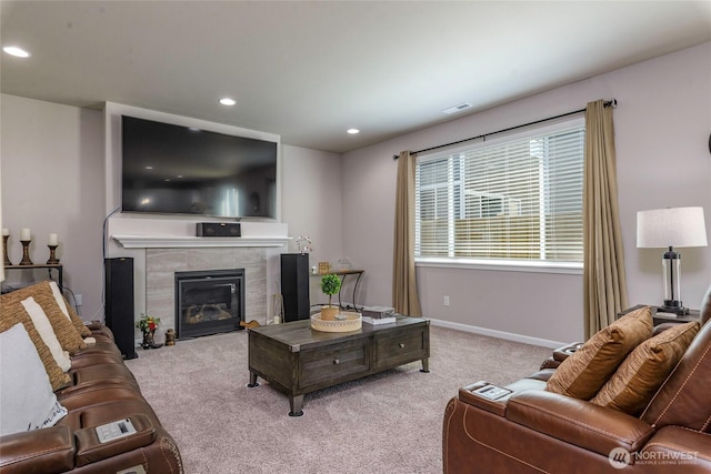 living room featuring visible vents, a fireplace, carpet floors, baseboards, and recessed lighting