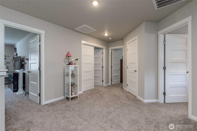 carpeted bedroom featuring visible vents, recessed lighting, baseboards, and a closet