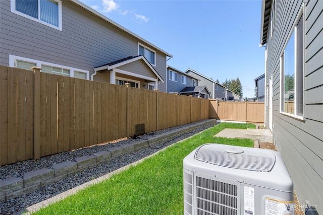 view of yard featuring cooling unit and a fenced backyard
