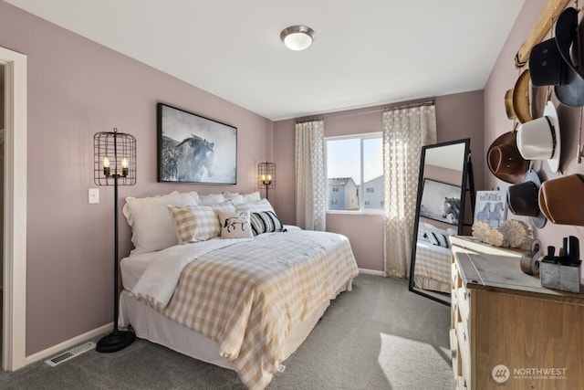 bedroom featuring carpet floors, baseboards, and visible vents