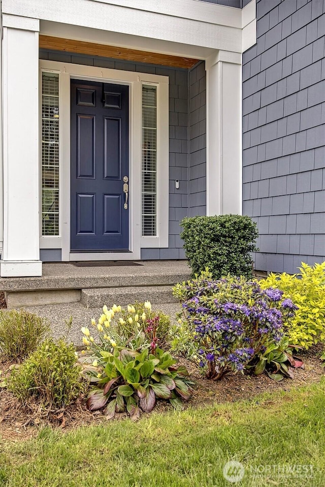doorway to property featuring covered porch