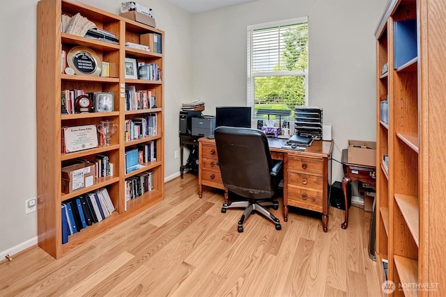 office featuring baseboards and wood finished floors