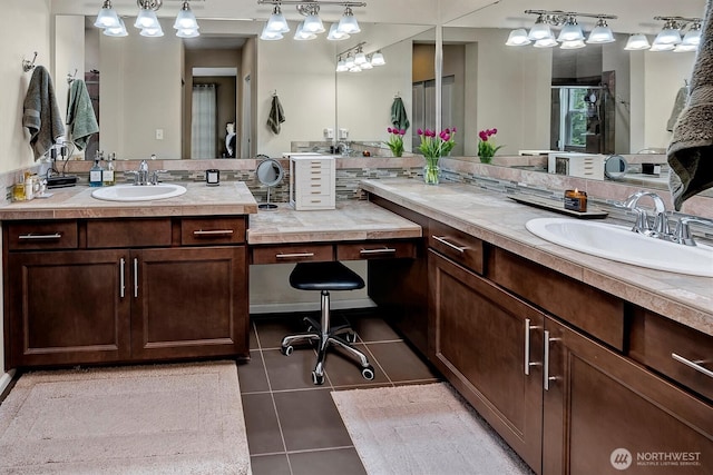 full bathroom featuring tile patterned flooring, a sink, two vanities, and a shower stall