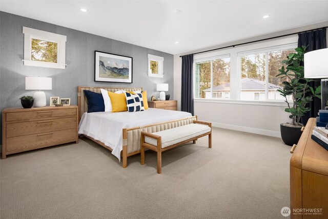 bedroom with baseboards, recessed lighting, and light carpet