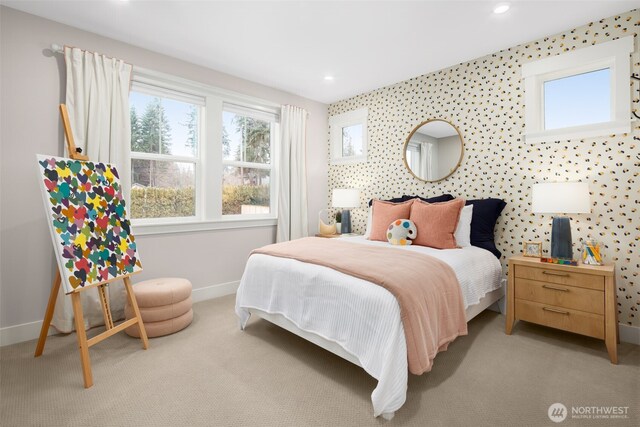 bedroom with baseboards, recessed lighting, and light carpet