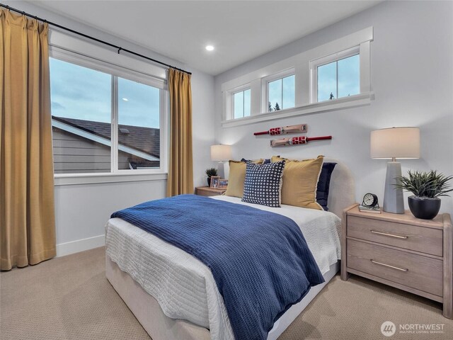 bedroom featuring baseboards, recessed lighting, and light colored carpet