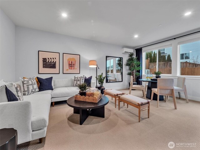 living room featuring carpet, baseboards, a wall unit AC, and recessed lighting