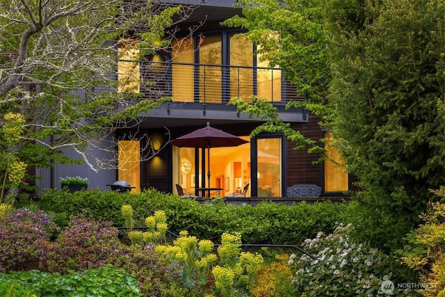 back of house with a balcony
