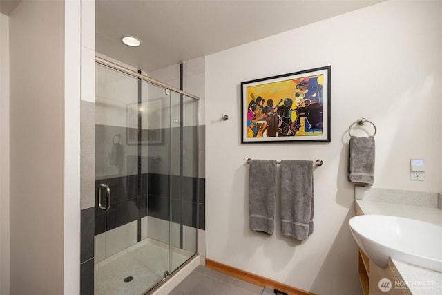 bathroom with vanity, baseboards, recessed lighting, tile patterned floors, and a stall shower