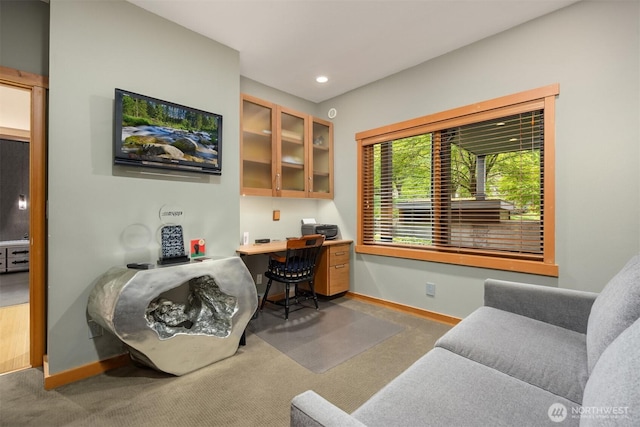 home office featuring baseboards, carpet flooring, recessed lighting, and built in desk