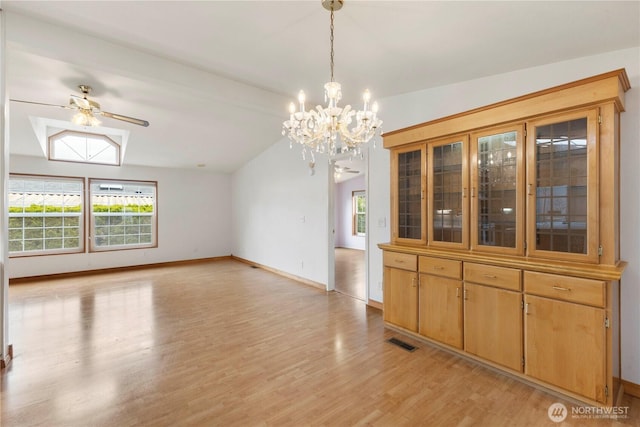 unfurnished dining area featuring baseboards, visible vents, light wood finished floors, and a wealth of natural light