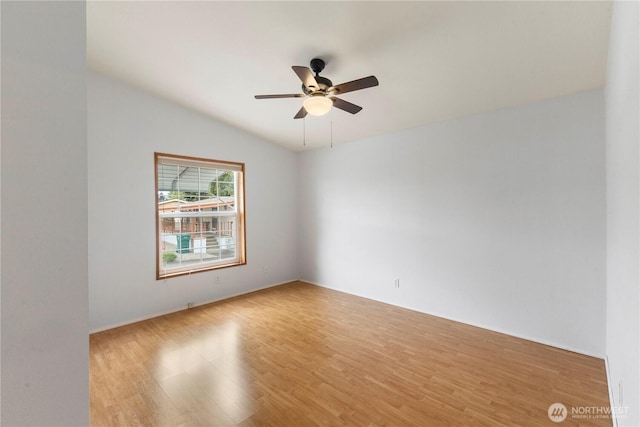 spare room featuring ceiling fan and light wood-style flooring