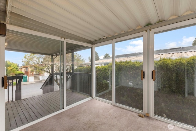 unfurnished sunroom featuring a healthy amount of sunlight