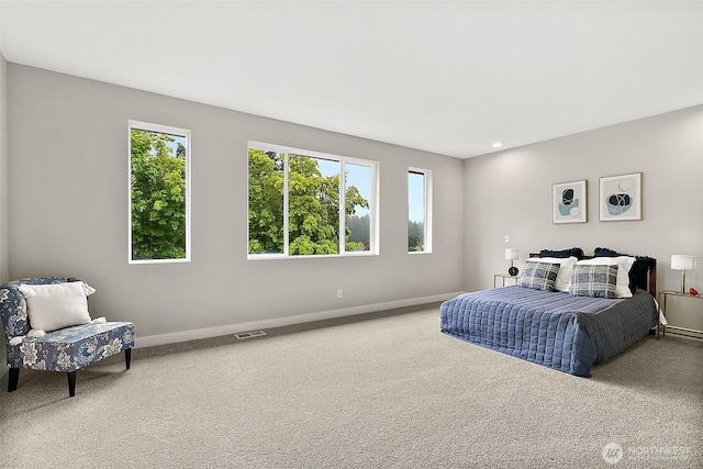 carpeted bedroom with recessed lighting, baseboards, and visible vents