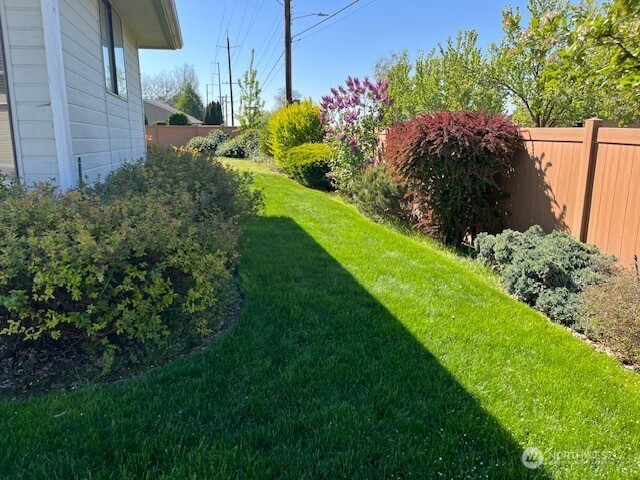 view of yard featuring fence