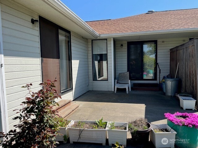 view of patio / terrace featuring fence