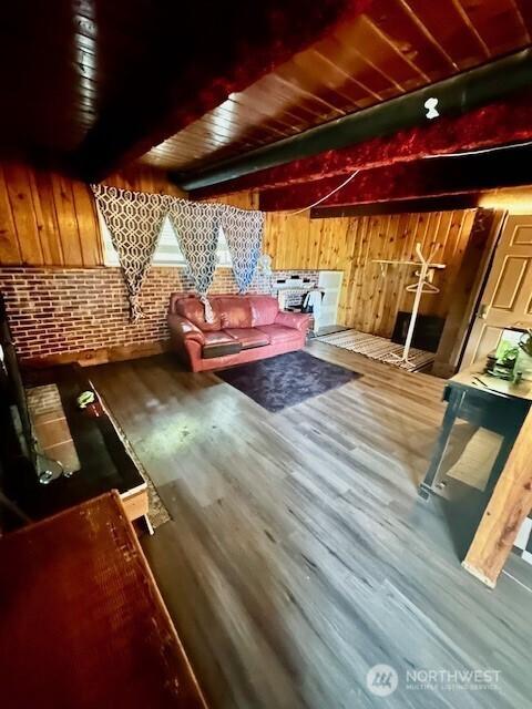 2232 177th Pl SW, Lynnwood, WA 98037 - living area with beam ceiling, wood walls, and wood finished floors