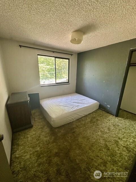 2232 177th Pl SW, Lynnwood, WA 98037 - bedroom featuring a textured ceiling and carpet