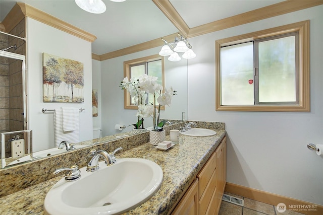 bathroom featuring visible vents, a sink, baseboards, and toilet
