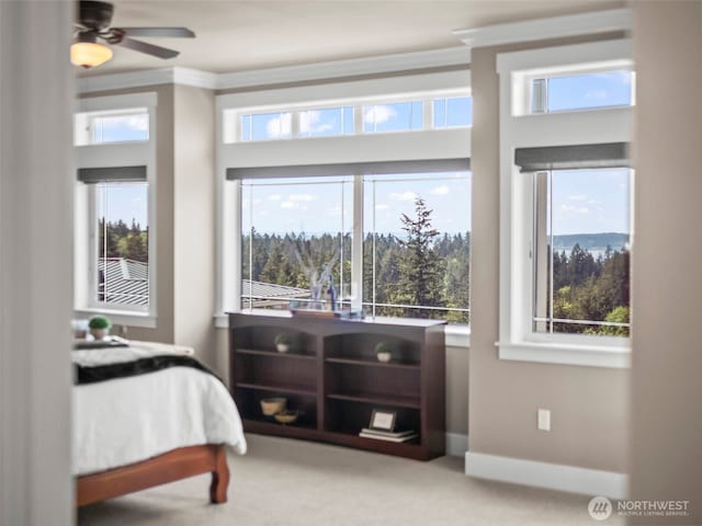 carpeted bedroom featuring baseboards and ornamental molding