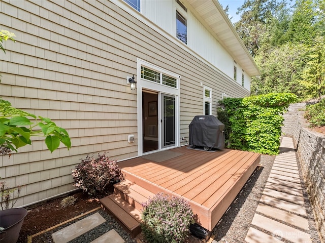 wooden terrace featuring area for grilling