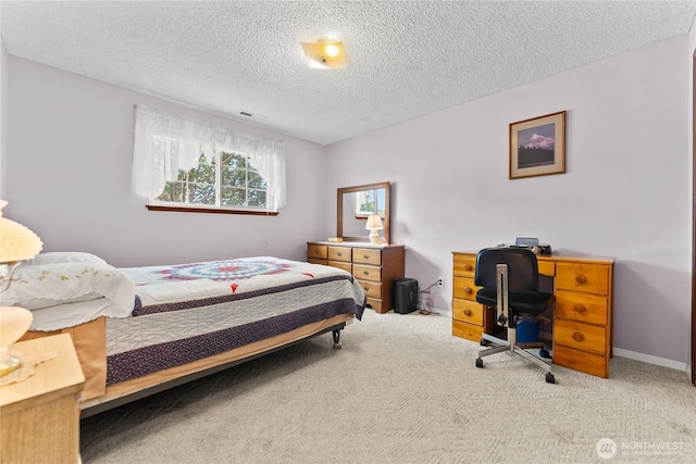 109 Lime St, Omak, WA 98841 - bedroom with baseboards, carpet flooring, a textured ceiling, and visible vents