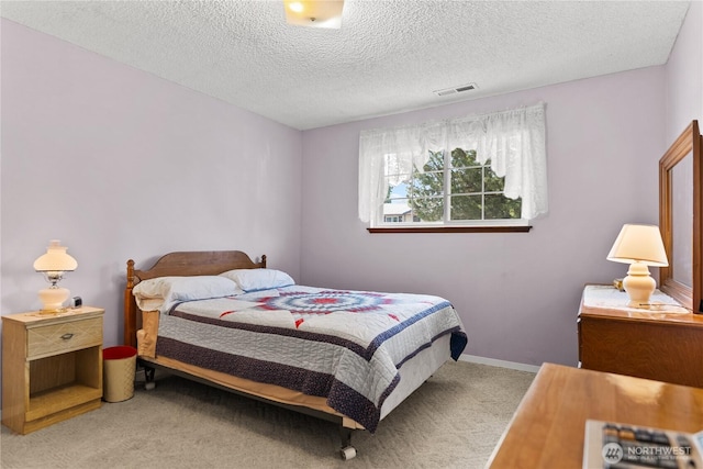 109 Lime St, Omak, WA 98841 - carpeted bedroom featuring visible vents and a textured ceiling