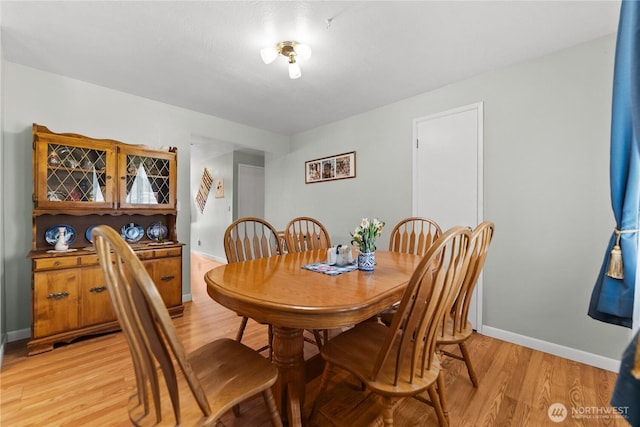109 Lime St, Omak, WA 98841 - dining room featuring light wood-type flooring and baseboards