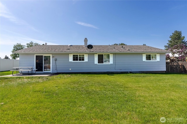 109 Lime St, Omak, WA 98841 - back of property featuring a patio, a lawn, and fence