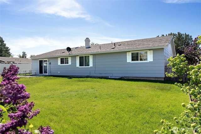 109 Lime St, Omak, WA 98841 - back of property featuring a lawn and a chimney