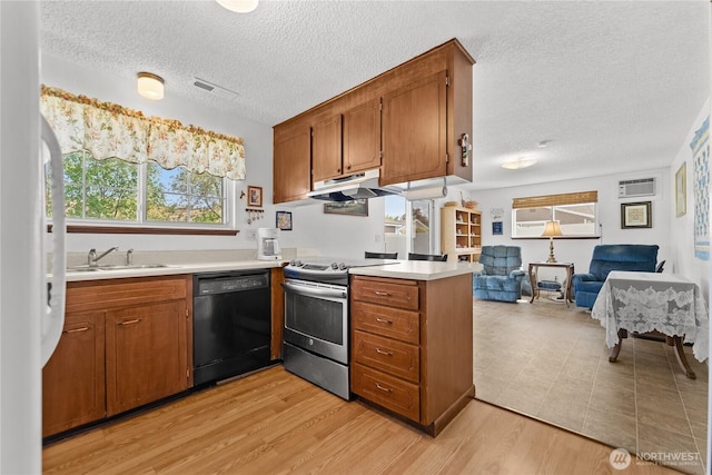 109 Lime St, Omak, WA 98841 - kitchen with light countertops, stainless steel electric range, under cabinet range hood, a sink, and dishwasher