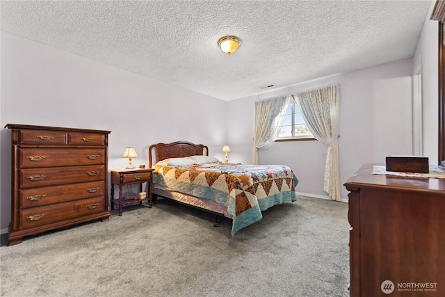 109 Lime St, Omak, WA 98841 - bedroom with light colored carpet, a textured ceiling, baseboards, and visible vents