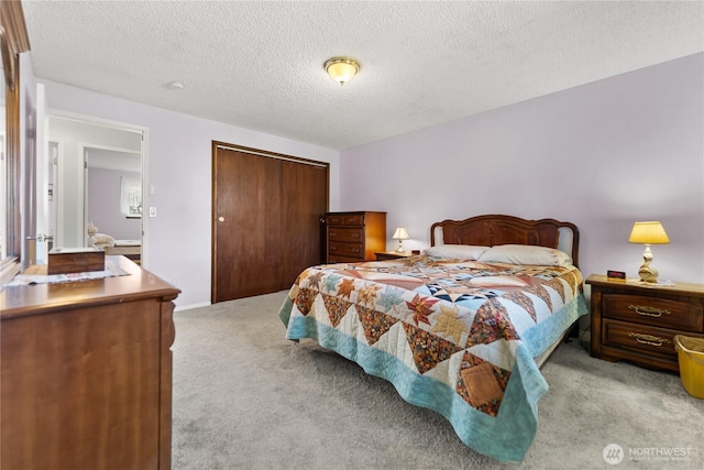 109 Lime St, Omak, WA 98841 - bedroom featuring a closet, a textured ceiling, and light colored carpet