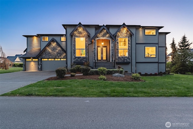1985 Bayview St, Blaine, WA 98230 - view of front of home featuring stone siding, driveway, a front yard, and a garage