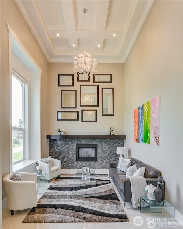 1985 Bayview St, Blaine, WA 98230 - sitting room with a chandelier, a stone fireplace, ornamental molding, tile patterned flooring, and coffered ceiling