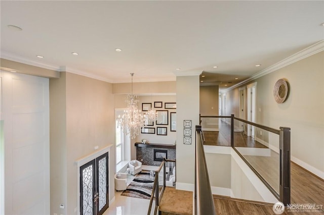 1985 Bayview St, Blaine, WA 98230 - hall with a chandelier, wood finished floors, ornamental molding, recessed lighting, and baseboards