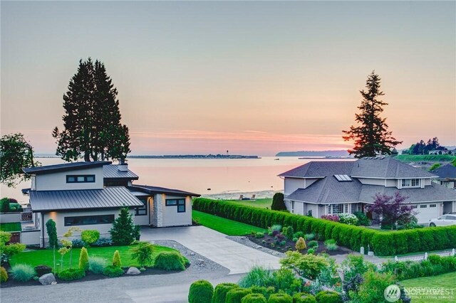 1985 Bayview St, Blaine, WA 98230 - view of front facade featuring a water view, driveway, metal roof, and a lawn