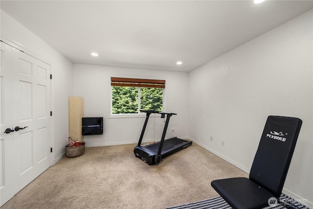 exercise area with recessed lighting, baseboards, and carpet floors