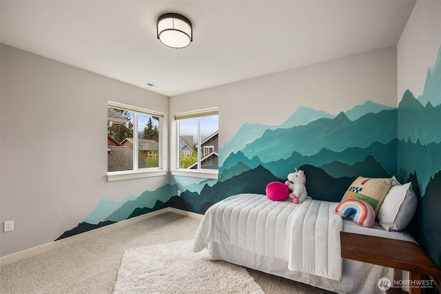 bedroom with carpet floors, baseboards, and visible vents