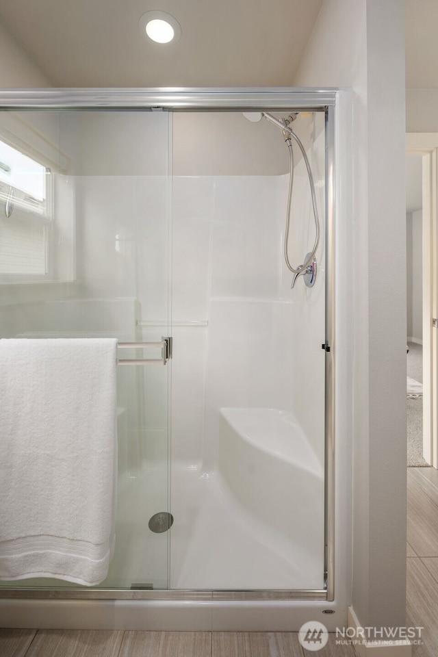 full bathroom featuring a shower stall