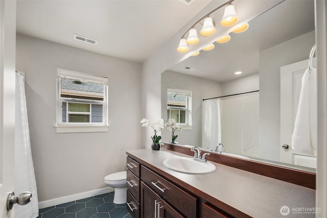 full bathroom with tile patterned flooring, vanity, toilet, baseboards, and visible vents