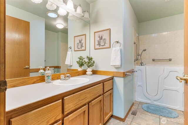 bathroom featuring tile patterned floors, vanity, and visible vents