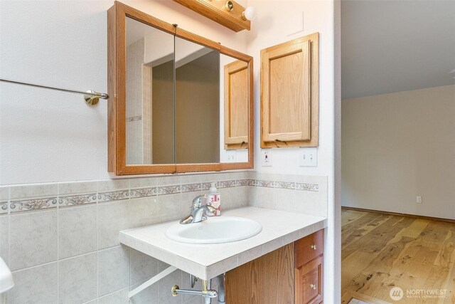 bathroom featuring a sink and wood finished floors