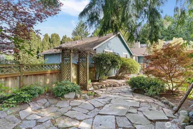 view of patio / terrace featuring fence