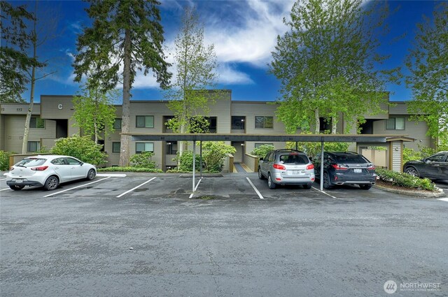 view of partially covered parking lot