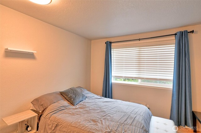 bedroom featuring a textured ceiling