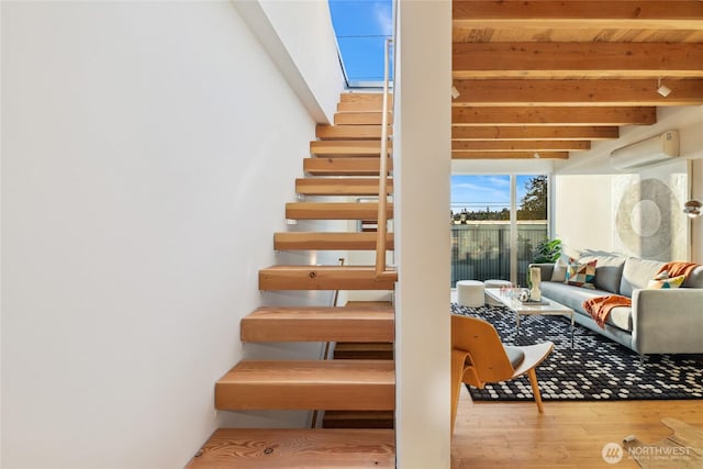 115 E Allison St, Seattle, WA 98102 - stairway featuring beam ceiling, a wall mounted AC, and wood finished floors