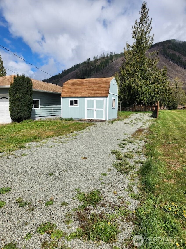 view of shed with a mountain view