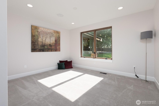 empty room with visible vents, carpet flooring, baseboards, and recessed lighting