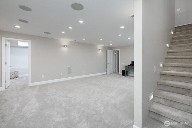 interior space with carpet flooring, recessed lighting, and baseboards